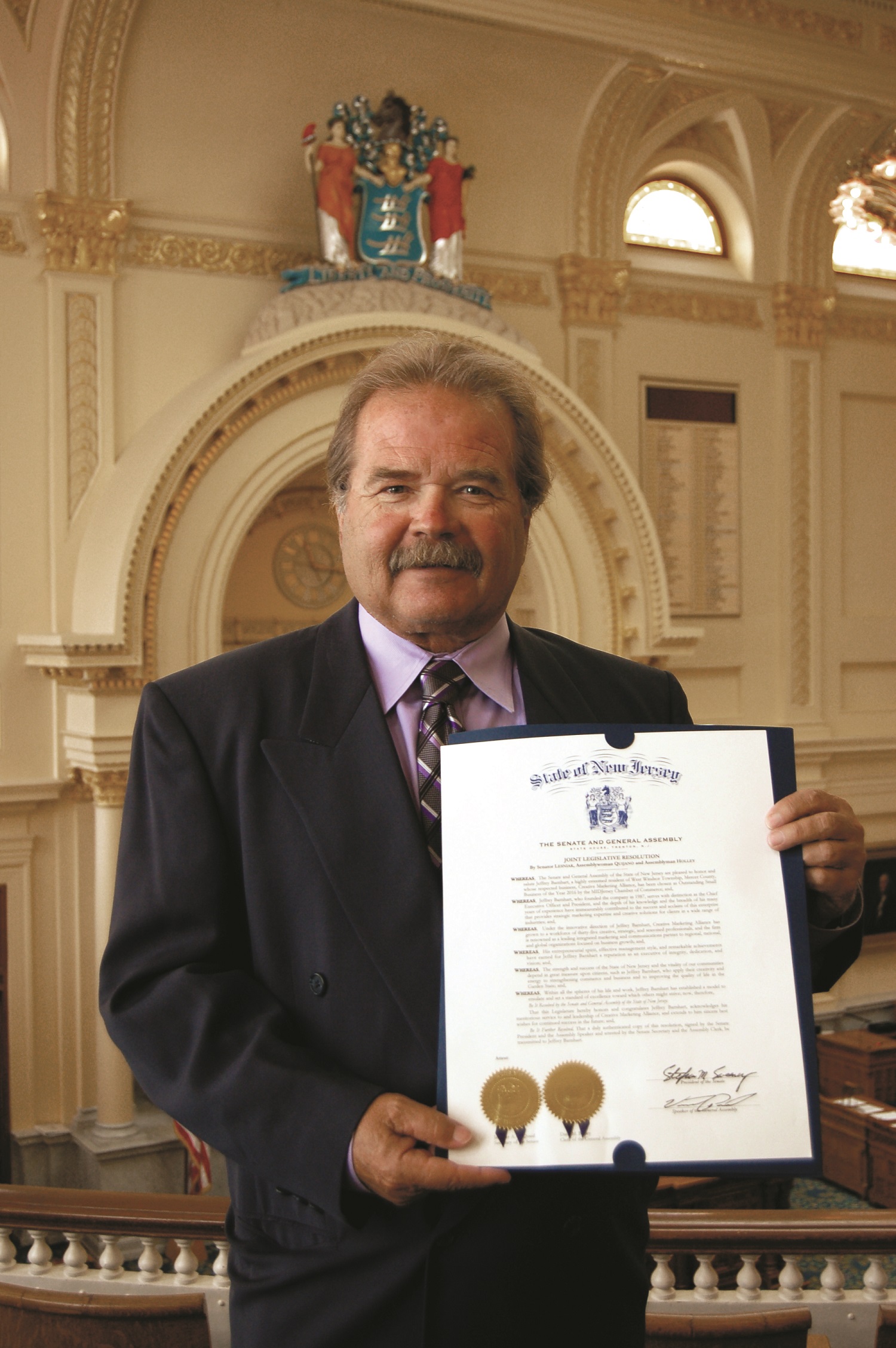 Jeffrey Barnhart, CMA CEO and president, whose firm was recognized for its history of helping businesses grow with branding, marketing and public relations, with the proclamation at the New Jersey Statehouse.